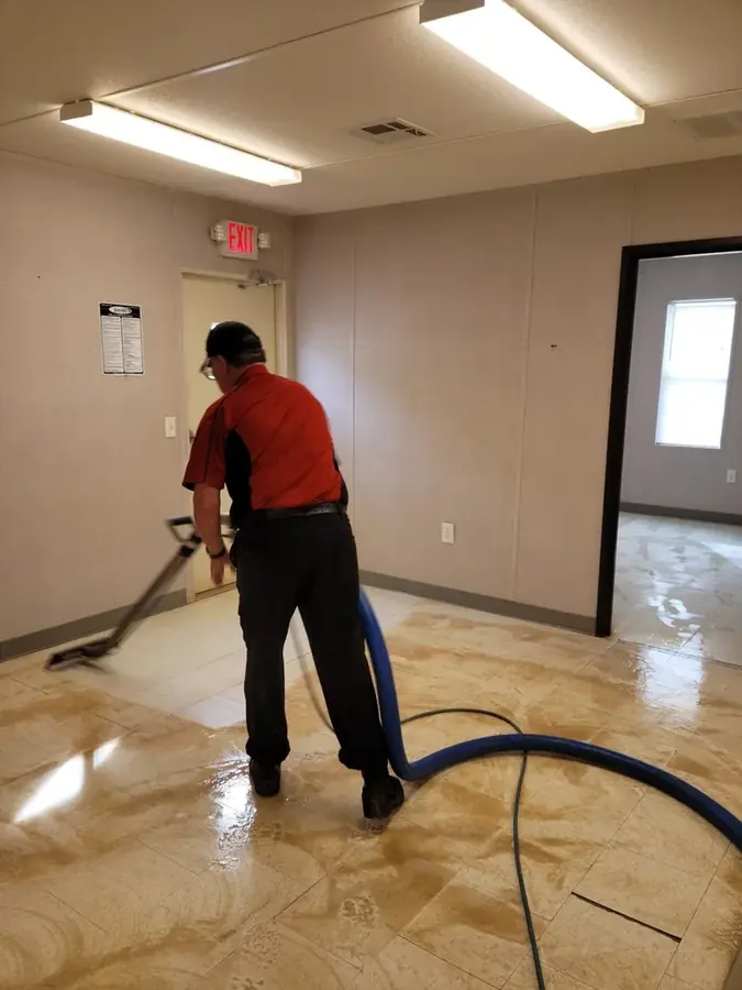 Air movers and a dehumidifier drying a water damaged Four Oaks home
