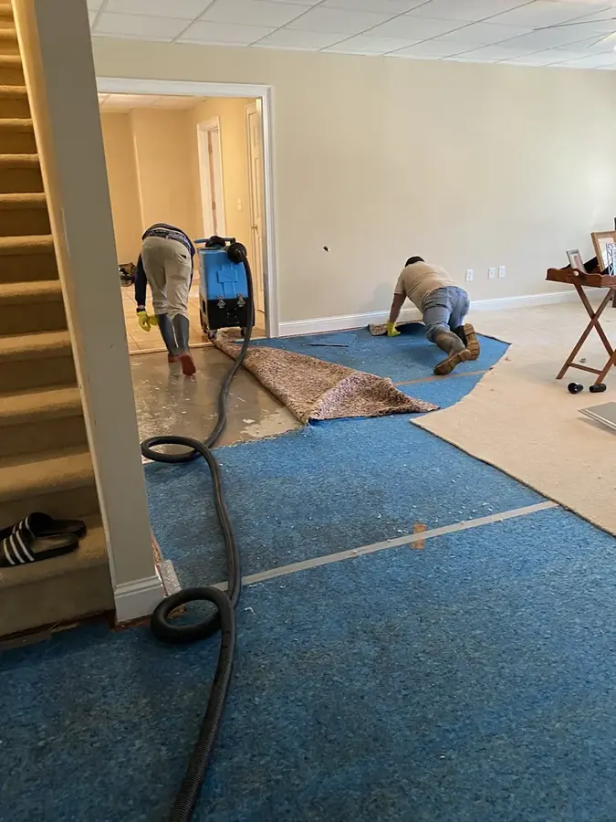 Flooded basement being pumped out in Johnston County