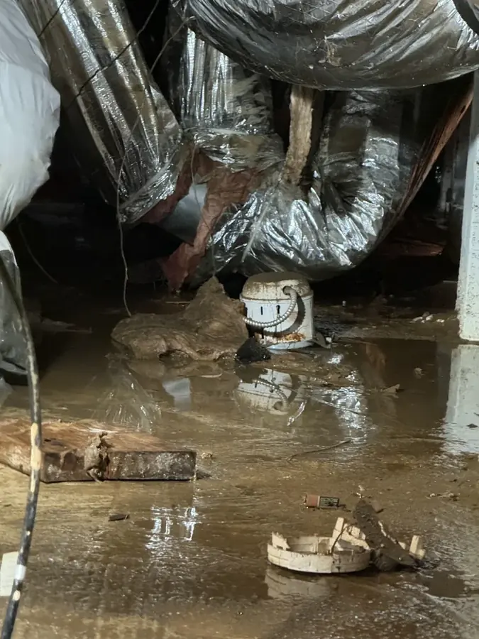 Frozen and split water pipe in a Johnston County crawl space